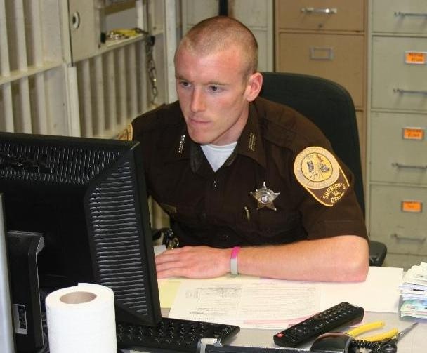 man at jail desk